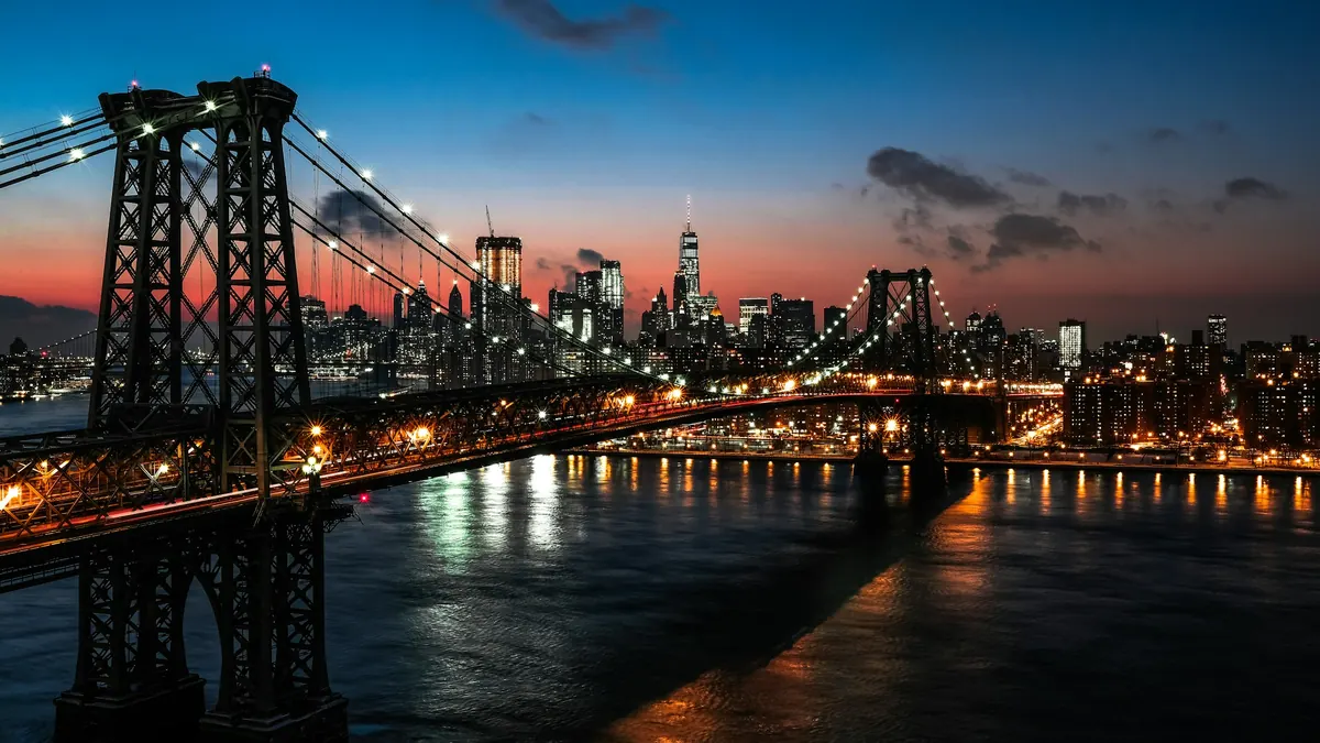 The Williamsburg Bridge and Manhattan lit up at night
