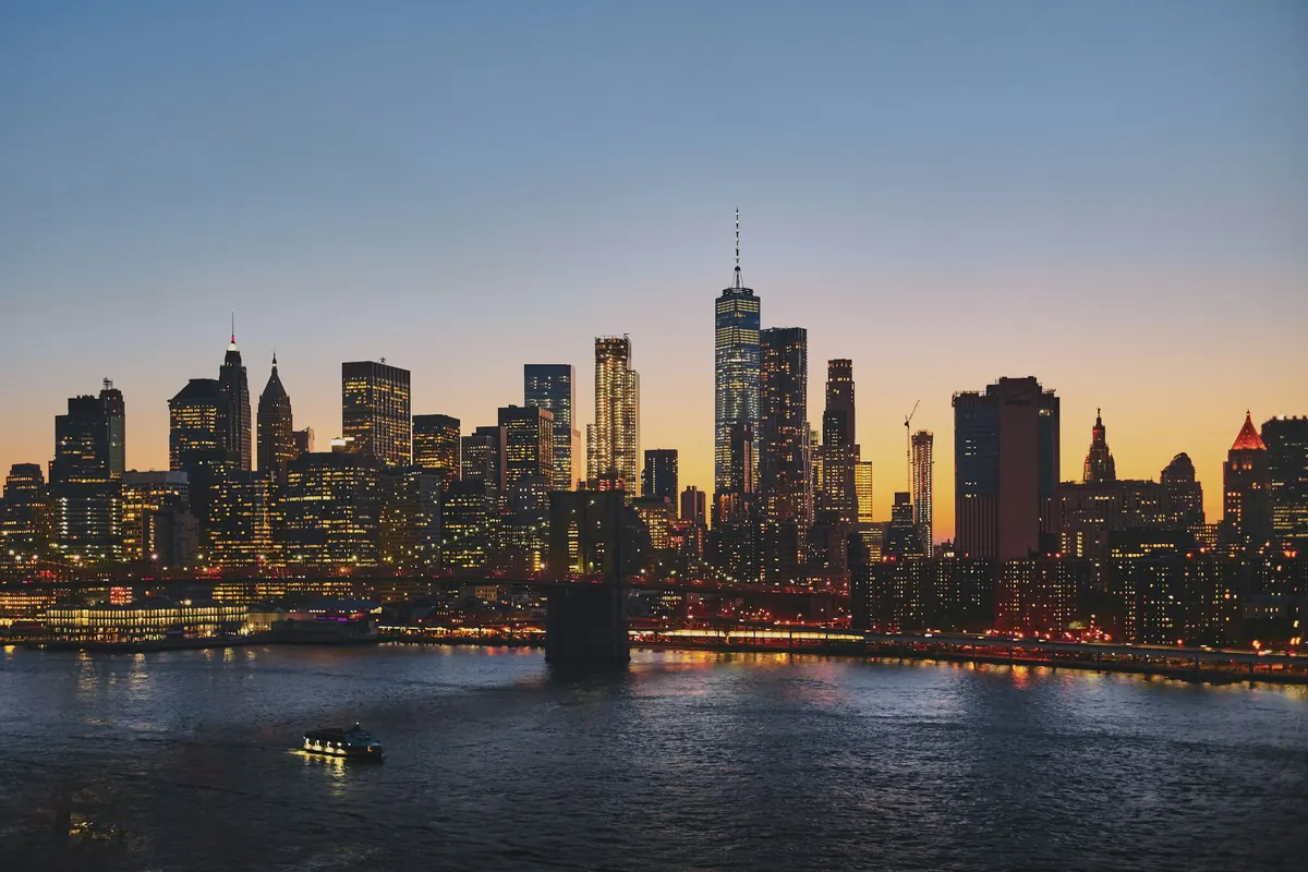 Lower Manhattan's skyline across the East River at dusk