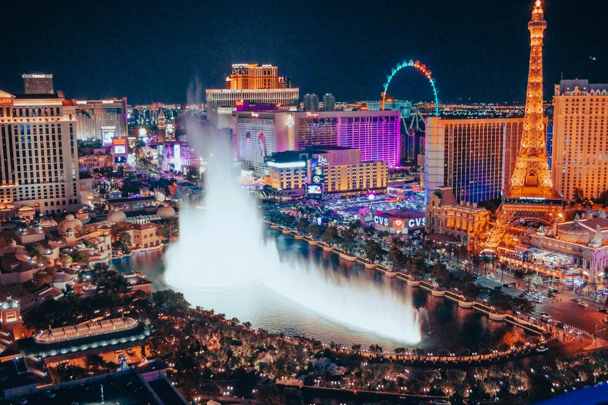 The Bellagio fountains and the Strip lit up at night